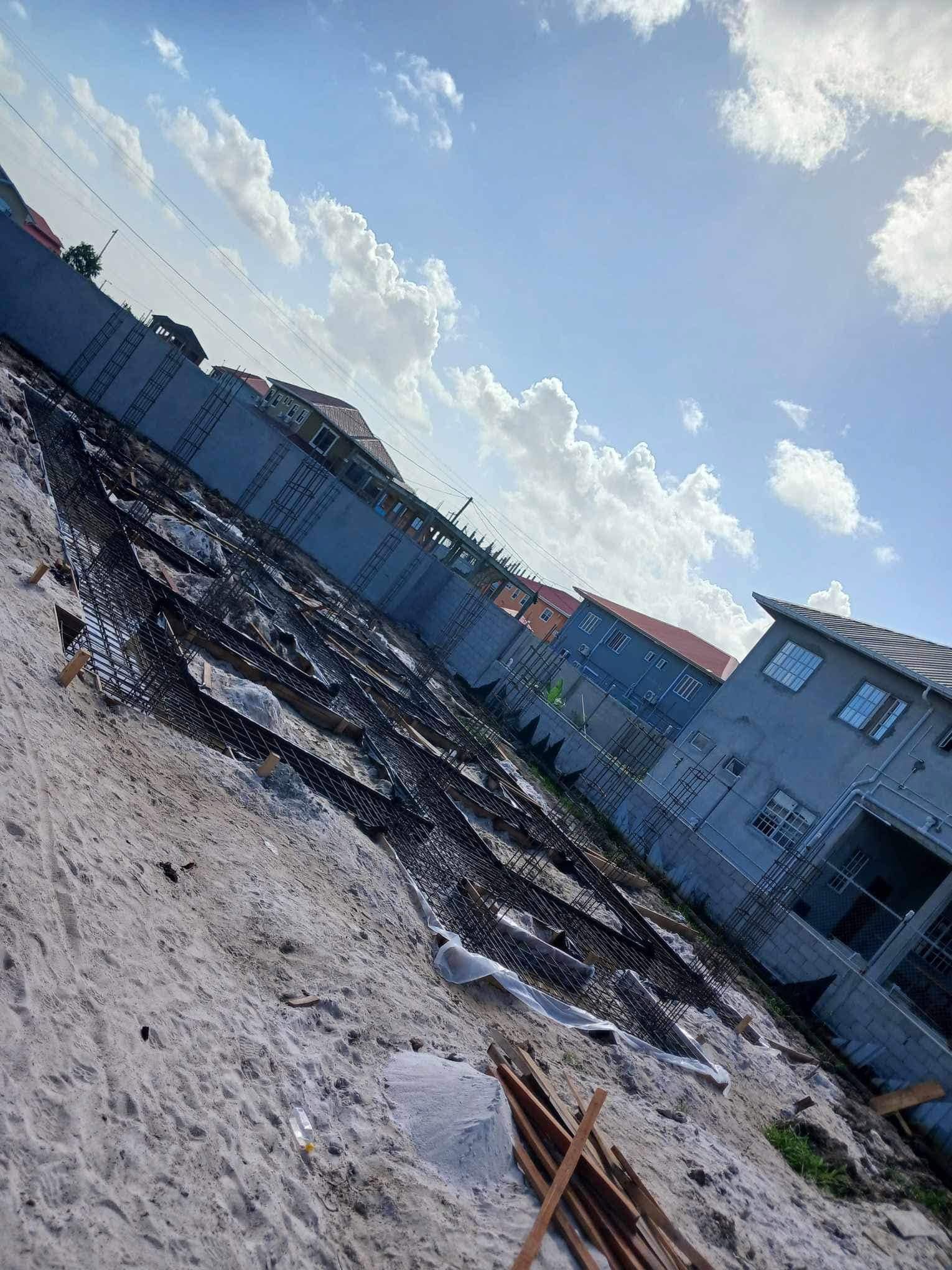 S. McAllister crew member on a house construction site in Georgetown, Guyana
